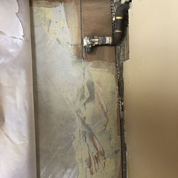 La Mesa Flooring - a picture of a damaged wall - Carpet Installation Near Me - La Mesa, California