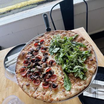 Koloa Pizza Kitchen + Bar - First half is "choose your own". We got mushroom and pepperoni. Second half is "garlicky white devil". - Pizza Near Me - Koloa, Hawaii