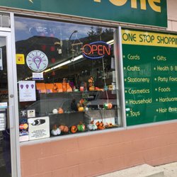 Lucky Dollar Plus Store - Closer view of storefront - entrance, window display & signage (visit, end of Sept/19).