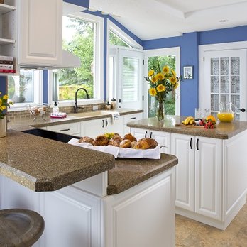 NuStone Transformations - a kitchen with blue walls and white cabinets - General Contractors Near Me - Kitchener, Ontario NuStone Transformations - a kitchen with blue walls and white cabinets - General Contractors Near Me - Kitchener, Ontario
