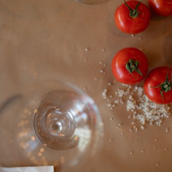 Malka - tomatoes and salt on a table - Kosher Near Me - New York, New York