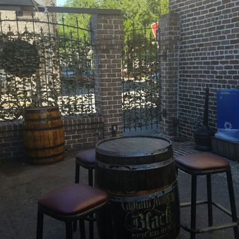 The Rail Pub - Cute barrel tables on the patio - Pubs Near Me - Savannah, Georgia