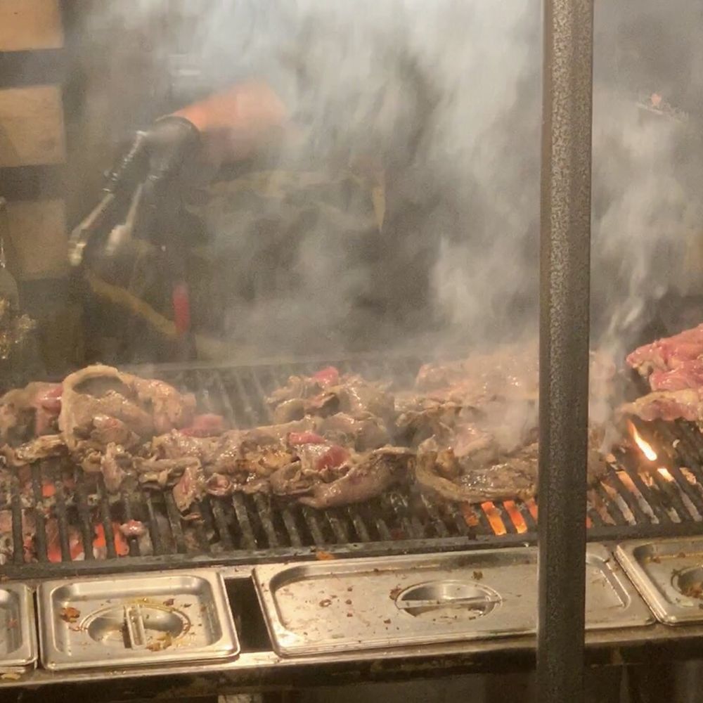 Ah Carbon Tacos - a man cooking on a grill - Tacos Near Me - Montebello, California