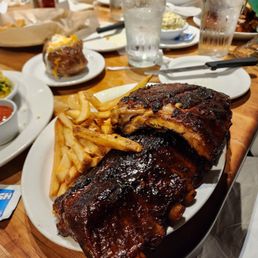 Full rack of honey bbq ribs and fries Full rack of honey bbq ribs and fries