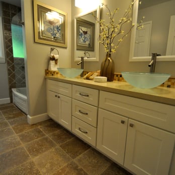 Ghirardelli Construction - This bathroom was designed to compliment an existing bath design. The tumbled travertine, provides a contemporary and elegant feel. - General Contractors Near Me