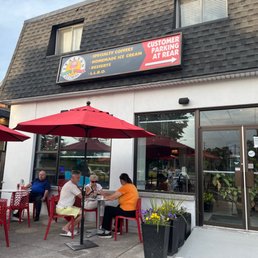 The logo, and the outside and the chairs and tables