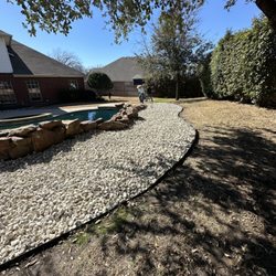Rauls Lawn Care - Limestone rock installed