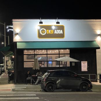 Desi Adda - the outside of a restaurant at night - Indian Near Me - Denton, Texas