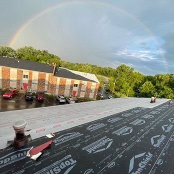 Anariba - a rainbow in the sky over a roof - Roofing Near Me Anariba - a rainbow in the sky over a roof - Roofing Near Me