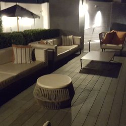 Midtown Apartments - Night time roof top lounge