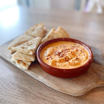 Hellenic Greek Kitchen - a bowl of dip and pita chips - Greek Near Me - Charlotte, North Carolina Hellenic Greek Kitchen - a bowl of dip and pita chips - Greek Near Me - Charlotte, North Carolina
