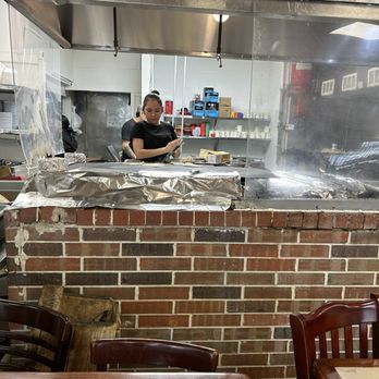 El Hidalguense Restaurant - The lady making the homemade corn tortillas so good. Smells like my mom's house - Mexican Near Me - Houston, Texas El Hidalguense Restaurant - The lady making the homemade corn tortillas so good. Smells like my mom's house - Mexican Near Me - Houston, Texas