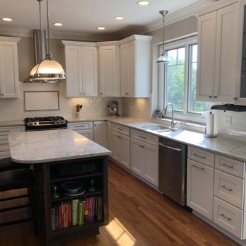 Imagine Construction Group - a kitchen with white cabinets and marble countertops - General Contractors Near Me - Naperville, Illinois Imagine Construction Group - a kitchen with white cabinets and marble countertops - General Contractors Near Me - Naperville, Illinois