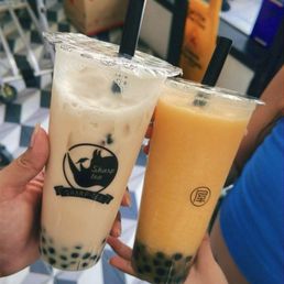 Peach Oolong Milk Tea with Boba, Mango Cloud Slush with Boba Peach Oolong Milk Tea with Boba, Mango Cloud Slush with Boba