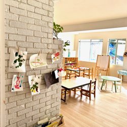 Caterpillar Cottage Preschool - Indoor classroom area, view of the art and sensory tables.