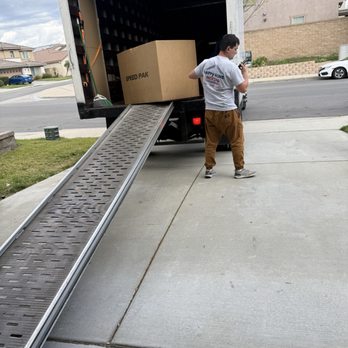 Happy Home Moving - Reloading their recycled boxes - Movers Near Me - Los Angeles, California