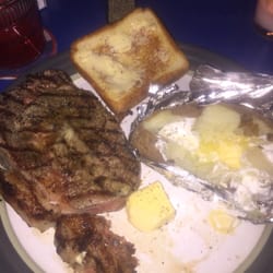 Danny Lee's Place - Ribeye steak with a baked potato or French fries, salad and Texas toast for $11 on Thursdays.  They do a great job.