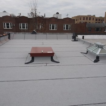 Big Apple Renovators - Brooklyn - Flat roof completed with hydraulic hatch and new skylight - Roofing Near Me - Brooklyn, New York