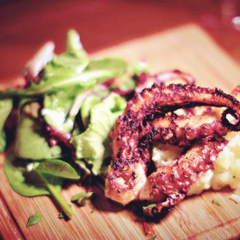 Jules Bistro - Grilled Octopus slow-cooked in citrus juice, served with mashed potatoes and mixed greens. - French Near Me - Toronto, Ontario Jules Bistro - Grilled Octopus slow-cooked in citrus juice, served with mashed potatoes and mixed greens. - French Near Me - Toronto, Ontario