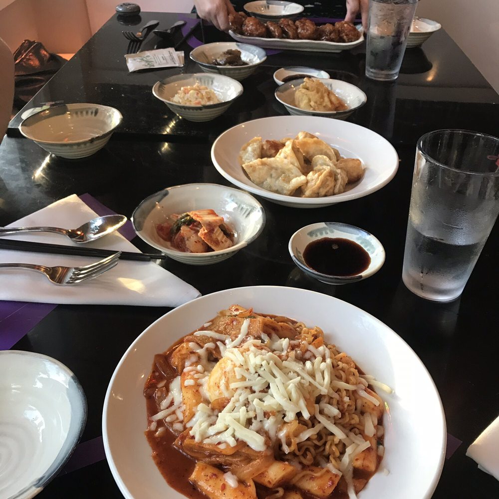 Bam Bam Kitchen - Fried Mandoo Combo in the middle, with side dishes and Honey Garlic Chicken Wings at the end and Cheese Ddeok-Boki at the front. - Korean Near Me - Ardmore, Pennsylvania
