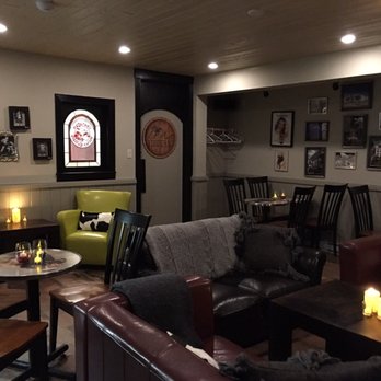 Bulldog Grande Cafe - a dog sitting on a couch - Cafes Near Me - Vernon, British Columbia