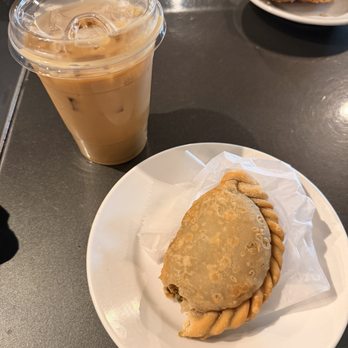 Engine Coffee - Iced vanilla latte with oat milk & vegan coconut curry empanada - Coffee & Tea Near Me - Chicago, Illinois
