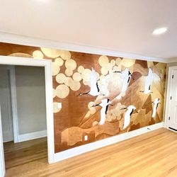 Wallpapering & Painting Pro - Custom wallpaper accent wall featuring artwork by an English designer.