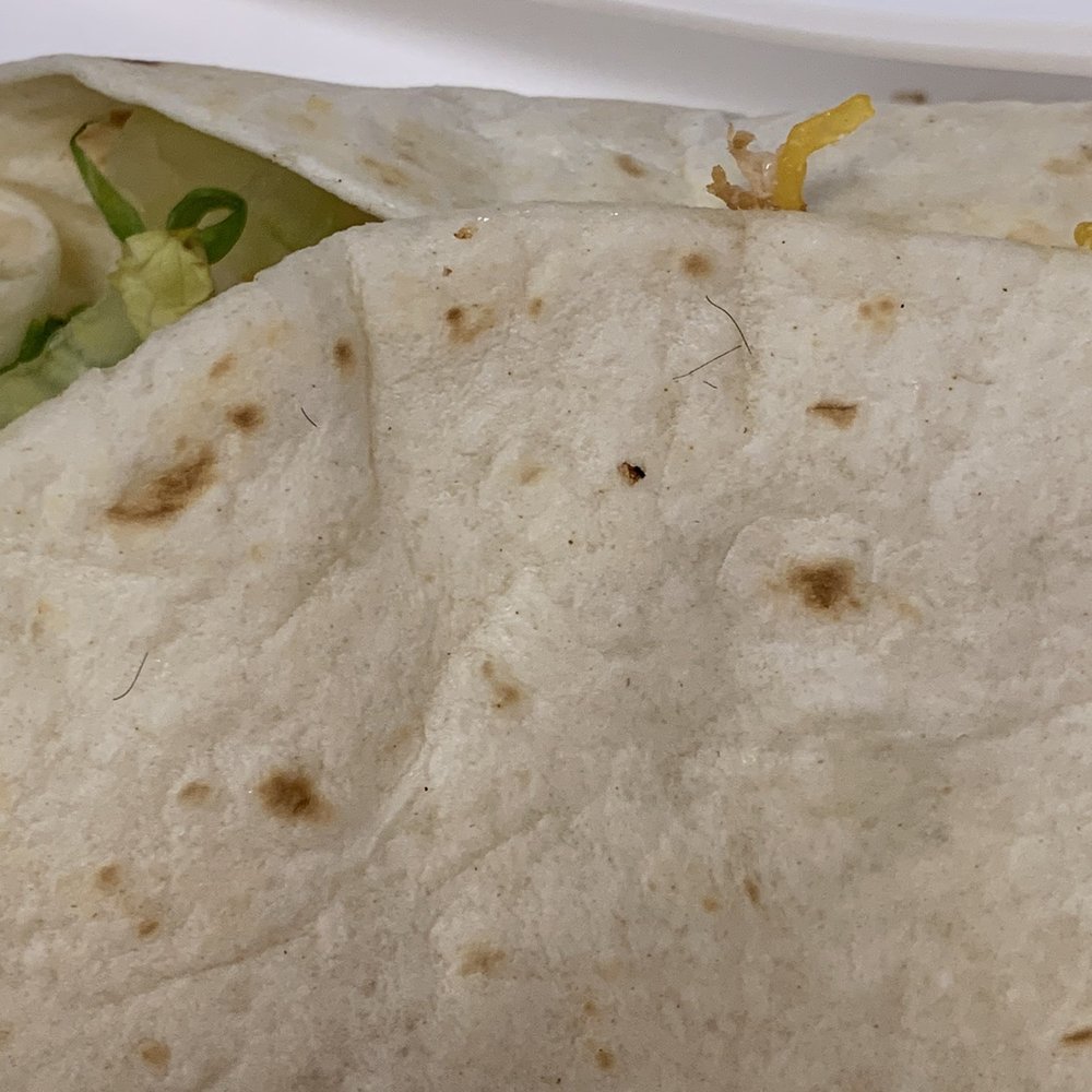 Del Taco - Chicken soft taco with hair or some kind of fibers on it. - Fast Food Near Me - Yuma, Arizona