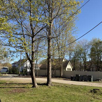 HM Flagg Tree Service - Our lines going diagonally through our yard. Nowhere near the tree they took down (next to the barrels) - Tree Services Near Me - Ayer, Massachusetts HM Flagg Tree Service - Our lines going diagonally through our yard. Nowhere near the tree they took down (next to the barrels) - Tree Services Near Me - Ayer, Massachusetts