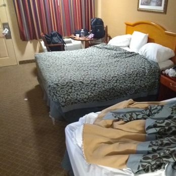 Days Inn by Wyndham Ruston LA - Not sure if you can see but the bed on the left is severely dented on the right side due to a broken box spring. - Hotels Near Me - Ruston, Louisiana Days Inn by Wyndham Ruston LA - Not sure if you can see but the bed on the left is severely dented on the right side due to a broken box spring. - Hotels Near Me - Ruston, Louisiana