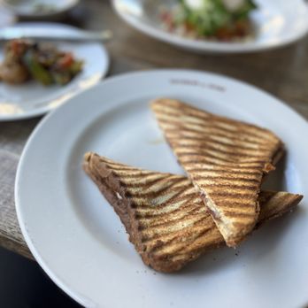 Taverna del Bisbe - Iberian cured ham and manchego cheese "bikini" sandwich - Catalan Near Me - Barcelona, B Taverna del Bisbe - Iberian cured ham and manchego cheese "bikini" sandwich - Catalan Near Me - Barcelona, B