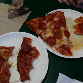 Stadium Pizza - My order on the left- my friend's fresh pizza on the right. Disgusting pizza. - Pizza Near Me - San Jacinto, California