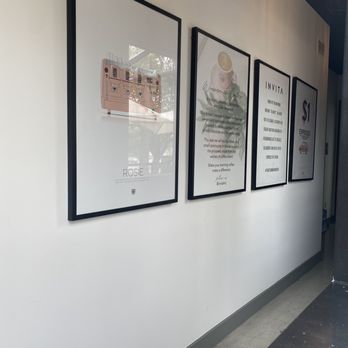 INVITA - a hallway with three framed posters on the wall - Coffee & Tea Near Me - Carlsbad, California INVITA - a hallway with three framed posters on the wall - Coffee & Tea Near Me - Carlsbad, California
