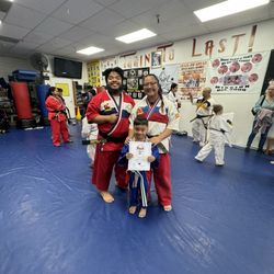 West Coast Mission Karate - Receiving his green belt as a dragon.