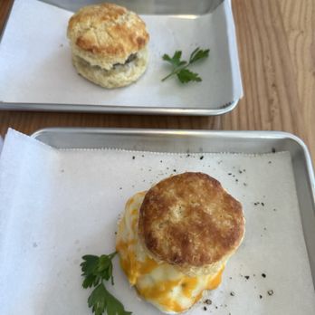 Lynny’s - Sausage biscuit (top) and good morning biscuit (bottom) - Breakfast & Brunch Near Me - Austin, Texas Lynny’s - Sausage biscuit (top) and good morning biscuit (bottom) - Breakfast & Brunch Near Me - Austin, Texas