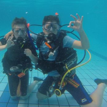 Riverside Scuba - NAUI Junior Scuba Diver Course. Two students performing their pool training skills. - Dive Shops Near Me - Riverside, California