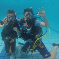 Riverside Scuba - NAUI Junior Scuba Diver Course. Two students performing their pool training skills.