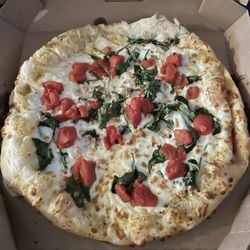 Domino's Pizza - The spinach is NOT supposed to be OVER the cheese. There's areas of the pizza where there is no spinach.
