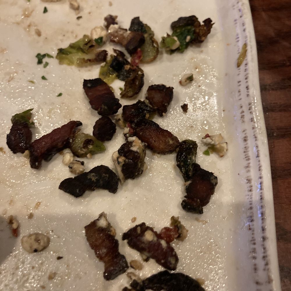 Ocean 302 - Burnt bacon pieces from the Brussel sprouts - New American Near Me - Melbourne Beach, Florida Ocean 302 - Burnt bacon pieces from the Brussel sprouts - New American Near Me - Melbourne Beach, Florida