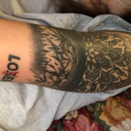 The mountain range tattoo was done by Murt. An absolutely talented artist.