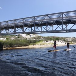 Green Fin Paddle Co. - Explore the area's signature dune lakes.