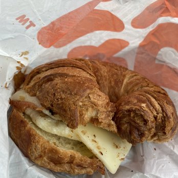 Dunkin' - A messy Bacon & Cheese Croissant Sandwich - Donuts Near Me - Harrison, New York