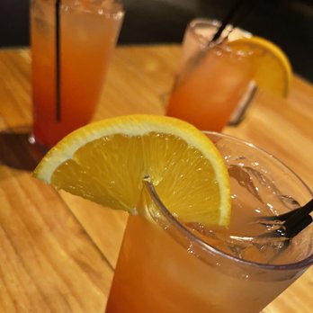 Bar Moxy - two glasses of orange juice with a slice of lemon - Lounges Near Me - New York, New York Bar Moxy - two glasses of orange juice with a slice of lemon - Lounges Near Me - New York, New York