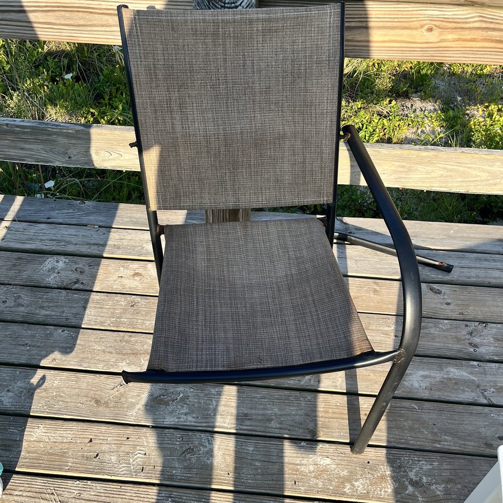Sleep Inn On The Beach - Three legged chair in the smoking area - Hotels Near Me - Orange Beach, Alabama Sleep Inn On The Beach - Three legged chair in the smoking area - Hotels Near Me - Orange Beach, Alabama