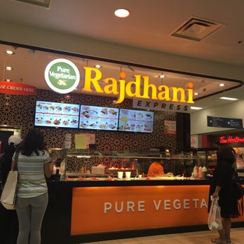 Rajdhani Express - a woman standing in front of the counter - Indian Near Me - Brampton, Ontario
