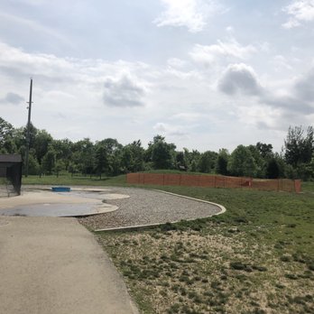 Heritage Trail Dog Park - Blocked off area in the background,pebbled area and splash pad in the foreground - Dog Parks Near Me - Hilliard, Ohio Heritage Trail Dog Park - Blocked off area in the background,pebbled area and splash pad in the foreground - Dog Parks Near Me - Hilliard, Ohio