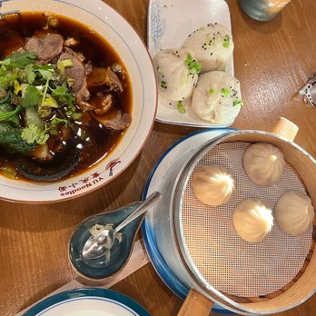 Yu Noodles - Pork Soup Dumplings (6pcs) S4. Pan-Fried Pork Bun N4. Sichuan Beef Noodle Soup - Chinese Near Me - Herndon, Virginia Yu Noodles - Pork Soup Dumplings (6pcs) S4. Pan-Fried Pork Bun N4. Sichuan Beef Noodle Soup - Chinese Near Me - Herndon, Virginia
