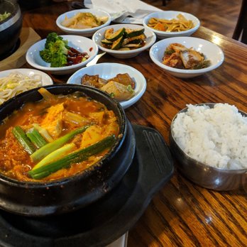 Sam Won Garden Restaurant - Kimchi, pork, and tofu stew with the various small dishes. - Korean Near Me - Jacksonville, Florida Sam Won Garden Restaurant - Kimchi, pork, and tofu stew with the various small dishes. - Korean Near Me - Jacksonville, Florida