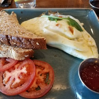 First Watch - White egg omelets, with onion and pepper. Filled with turkey bites and cheese. Served with multi grain bread and tomatoes, with jam. - Breakfast & Brunch Near Me - Gilbert, Arizona First Watch - White egg omelets, with onion and pepper. Filled with turkey bites and cheese. Served with multi grain bread and tomatoes, with jam. - Breakfast & Brunch Near Me - Gilbert, Arizona