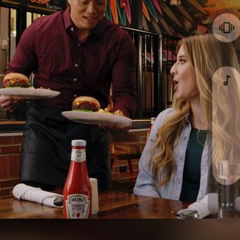 Jimmy John's - a man serving food to a woman - Sandwiches Near Me - Seattle, Washington